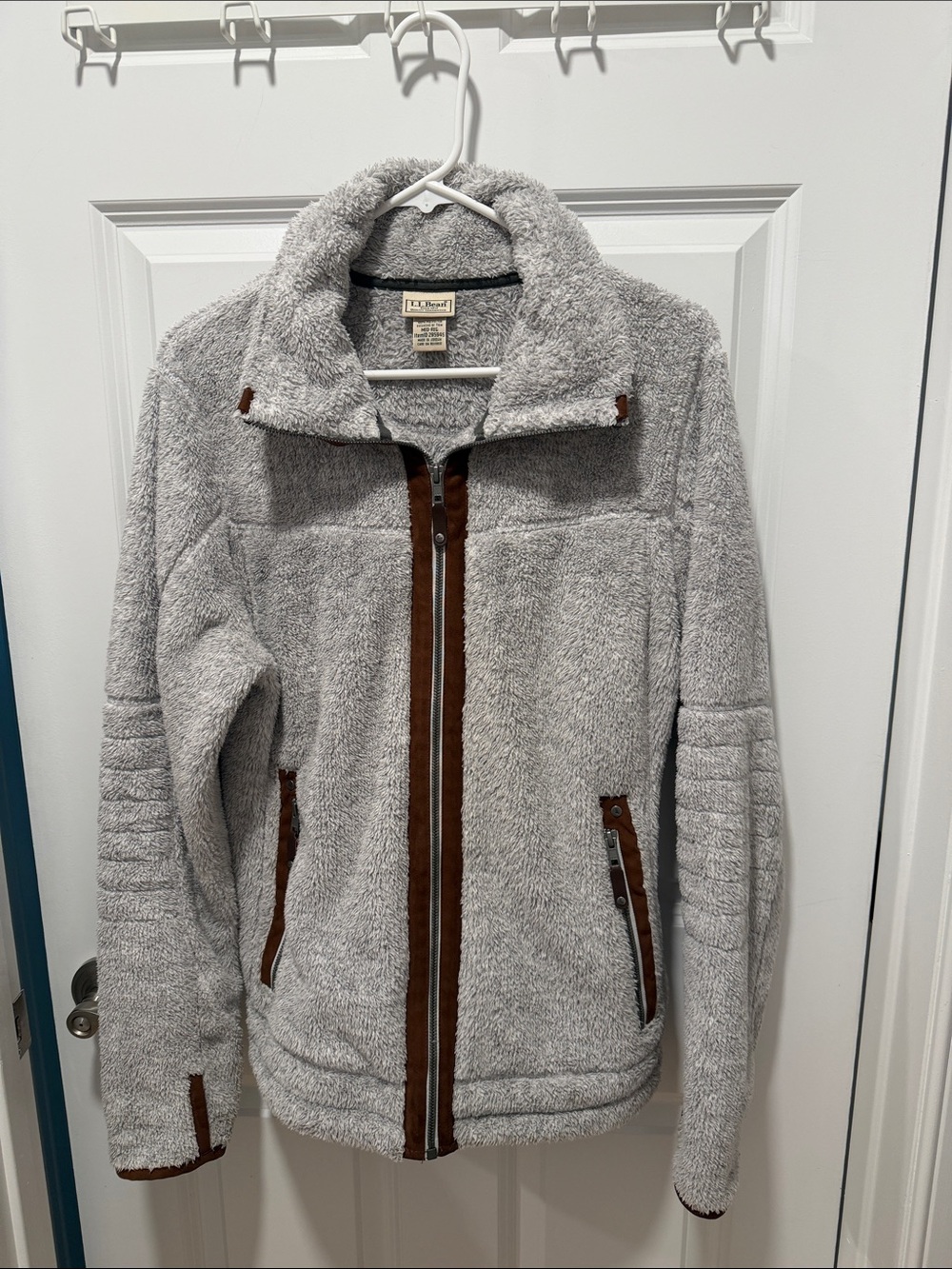 LLBean Women’s casual jacket in gray with brown trim. Two zipper pockets